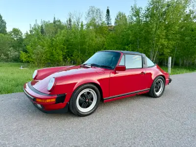 1987 Porsche 911 Targa G50 3.2 Carrera *Je parle Français aussi* - Rare Carmine Red on black. - 90,1...