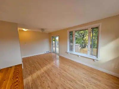 Bright upper level 2 bedroom with great natural light, a private deck, and views over a beautiful la...