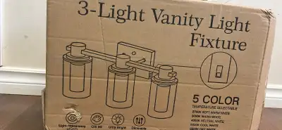 Brighten up your bathroom with this brand new 3-light vanity fixture, featuring a sleek black finish...