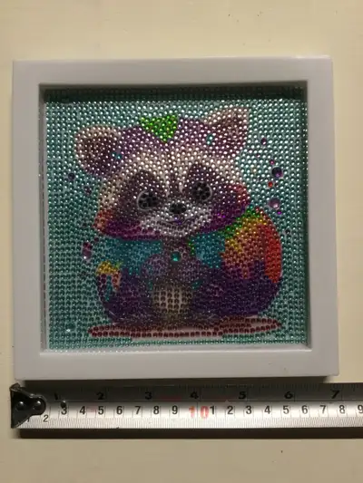 Cute diamond painting of a raccoon. Framed. Pick up in Ajax.