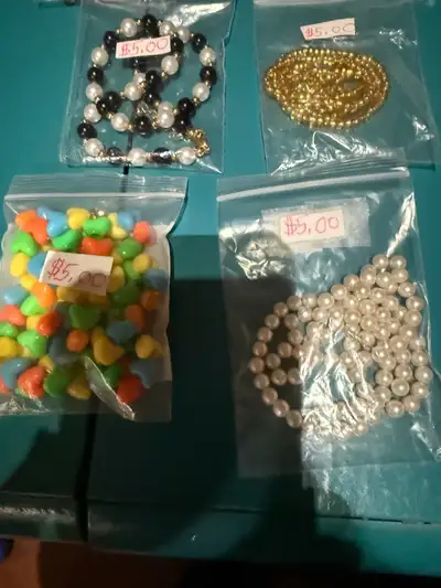 Shirley makes necklaces out of a variety of beads. Most are on fishing line. Most new beads, some us...