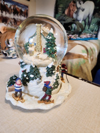 Musical rotating Christmas snow globe