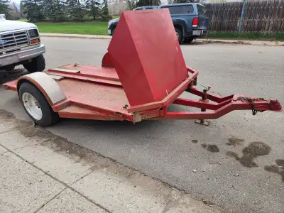 It's a trailer of all trailers! First of all its a motorcycle trailer (with hide away ramp) that dou...