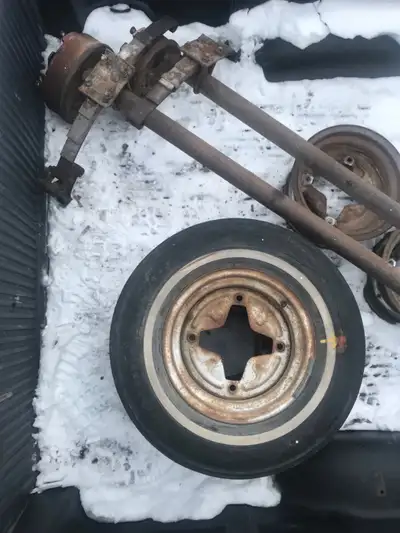 ATAM made in Canada four inch drop or rise 3500 pound trailer axles with leaf springs and electric b...