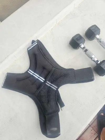 Boost your fitness routine with this AmStaff Fitness weighted vest and a pair of 5lb dumbbells. This...