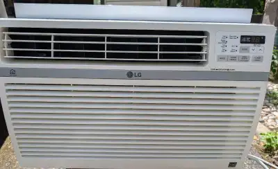 LG 10,000 BTU Window Air Conditioner. Model LW1017ERSM. Complete with remote control, window install...