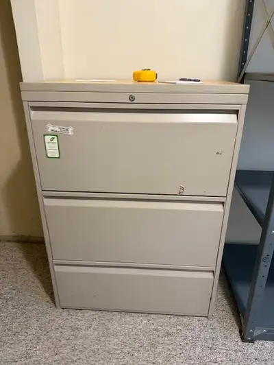 very handy filing cabinet - all metal. Some stickers on it. Dimensions 49.50 height x 18 deep x 36 w...