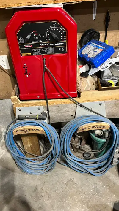 AC/DC arc welder, like new barely used. Comes with 75 ft neg cable and 75 ft pos cable plus welding...