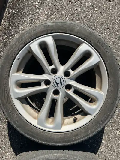 Two 8th gen civic si rims with continental tires, 7/32 ends tread remaining. Low ballers will be ign...