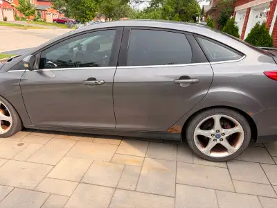 2012 Ford Focus, 4 door sedan, 183,000 km. Selling as-is and uncertified. There's rust in a few plac...