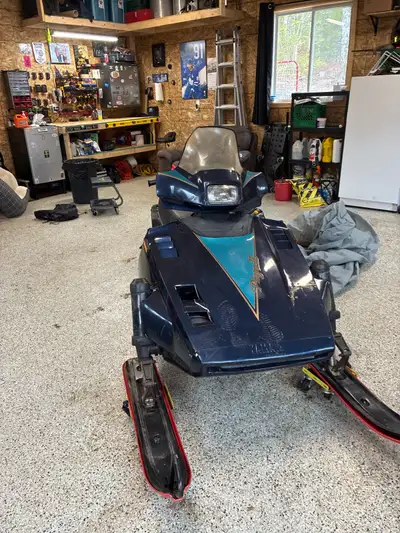 Brand new track. Ready for next season. Starts right up electric start.