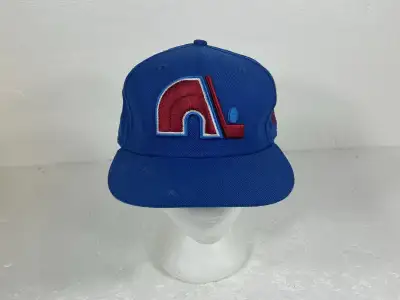 Get your hands on a piece of hockey history with this New Era Quebec Nordiques 59Fifty fitted cap, s...