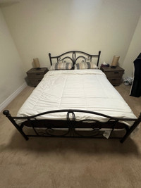 Queen bed frame including mattress, night stands, and lamps