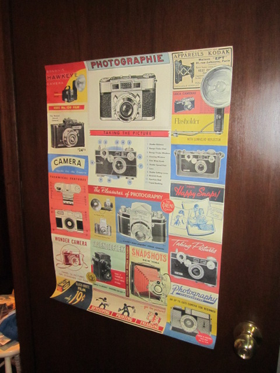 Vintage photography paper poster. With pictures of old cameras on it. Measures 20 X 27 1/2 inches. L...