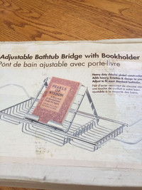 Brand new.  Adjustable bathtub bridge with Bookholder
