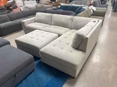 Brand new fabric sectional with storage ottoman, View more
