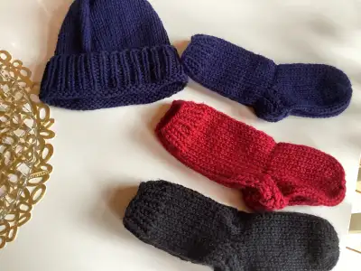 3 pairs of knitted socks and hat $10 NEW, View more