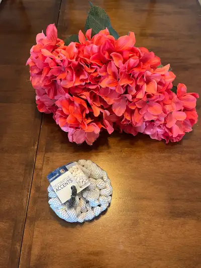 Pink silk flowers - (18” tall) and new white rocks. $10 for all. Pick up in Braeside (sw, 10 minutes...