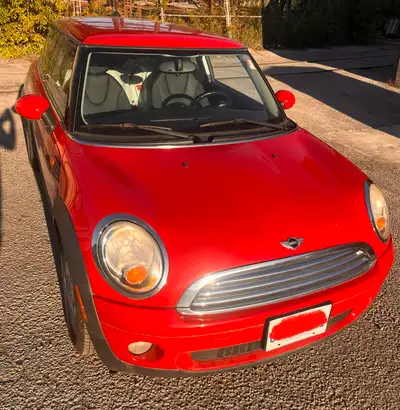 Selling as is. This is a red 2007 Mini Cooper hatchback, perfect for zipping around town! This cute...