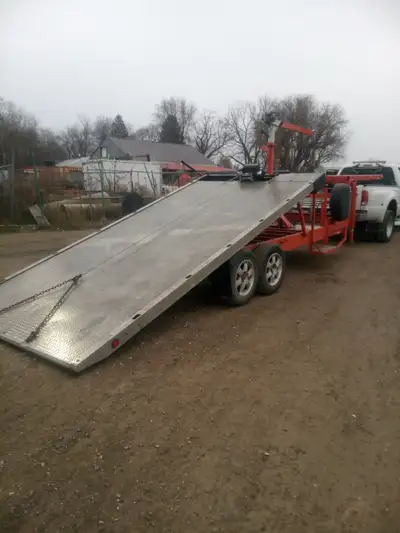 two flatbed trailers for rent one fifth wheel tilt and load with winch and straps and one bomper pul...