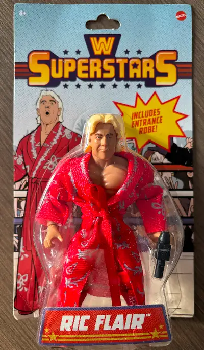 *Available if ad is up* Brand new and sealed Ric Flair figure, includes robe and microphone. Makes a...