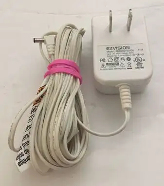 This is an Exvision AC Adapter, model ADN050750500. Input: AC 120V, 60Hz, 250mA, output: DC 7.5V, 50...