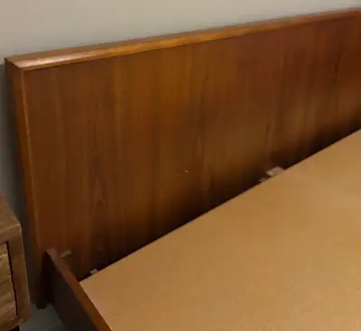 This is a stylish mid-century modern Mid-Century Modern teak queen platform bed, perfect for adding...