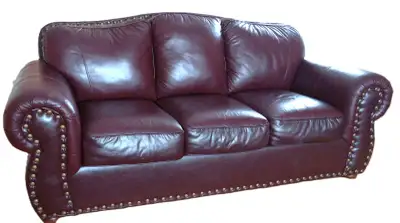 Beautiful, solidly built sofa upholstered in high-quality genuine corrected-grain leather (often cal...