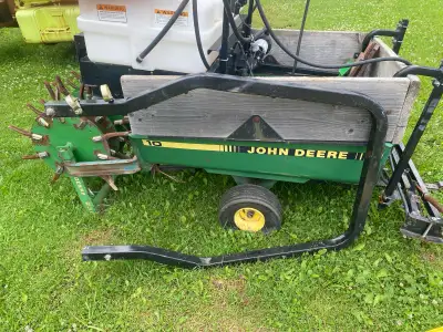 John Deere trailer with tank and sprayer unit, View more