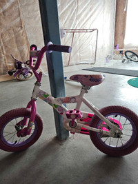 12' kids bike with training wheels. Pink and White