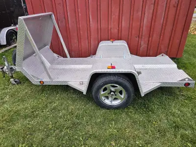 All aluminum tilt and load trailer just drive on and and tie it down brand new tires including spare...