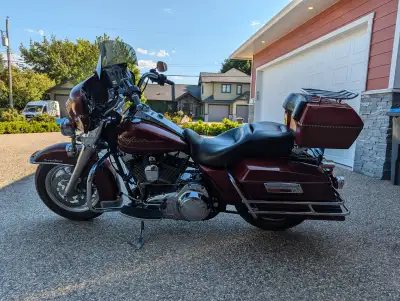 The 2008 Harley-Davidson Road King FLHR is a classic touring motorcycle that offers a smooth ride an...