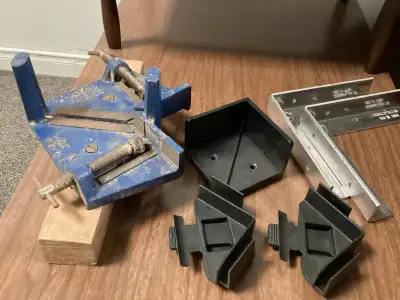 I'm selling a collection of used woodworking clamps, including a corner clamp and various angle brac...