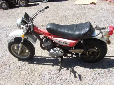 1972 Suzuki RV125 fat tire ,Tracker,,speedo ,,tach..lights..all original with a box of extra parts a...