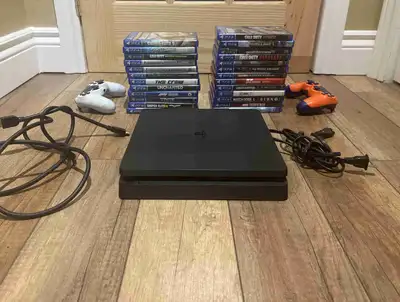 PS4 SLIM + 25 JEUX DISQUES + 2 MANETTES, View more