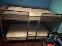 Twin bunk beds with mattresses
