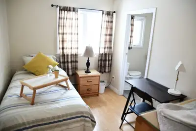 This cozy and well-maintained private room with adjoining private bathroom in single female owned re...