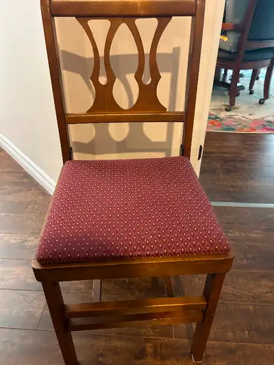 Four excellent condition folding chairs. Made in Canada approximately 1930’s. Cloth padded seats. Me...