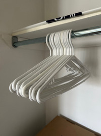 14 white clothes hangers