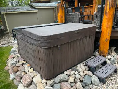 Used 6 person hot tub for sale, measures 84" x 84". Both pumps and cover less than a year old and ha...