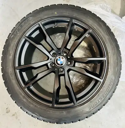 I'm selling a set of used winter tires with rims, perfect for a BMW X5 or other German SUVs, size 27...