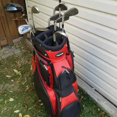 Goliath Golf Clubs with red bag. Includes 8 irons - 3,4,5,6,7,8,9 - 1 putter and 2 drivers. In excel...