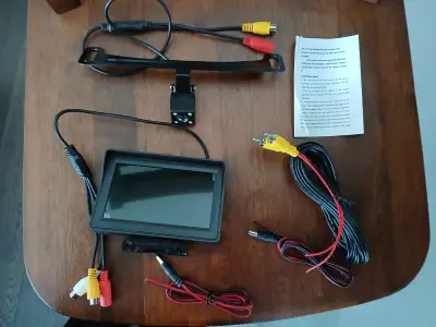 Brand new car rear view system includes 4” display monitor / rear view camera, connectors for revers...