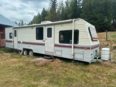 32’ pull-behind trailer. Fair condition, no leaks, all appliances work great. Vinyl floors in kitche...