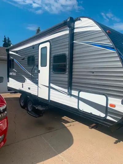 Has two 30 lb propane tank, two batteries, one solar panel, duel axle great for towing, air conditio...