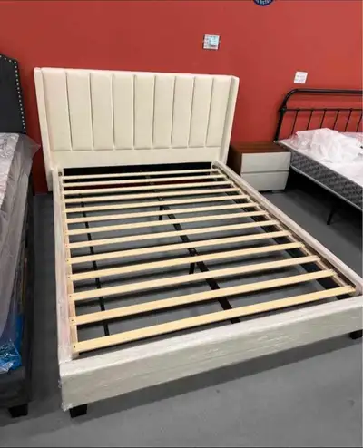 Add a touch of elegance to your bedroom with this brand new, queen-size bed frame featuring a stylis...
