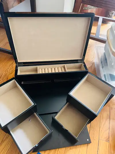 This black wood jewelry box is a stylish and functional storage solution for all your precious items...