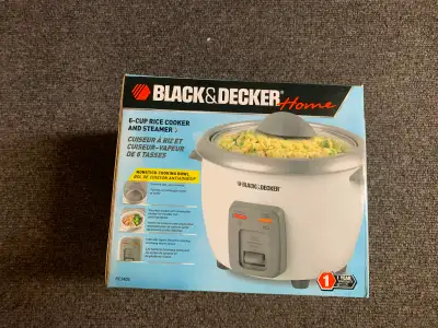 Six cup rice cooker, new, never used.