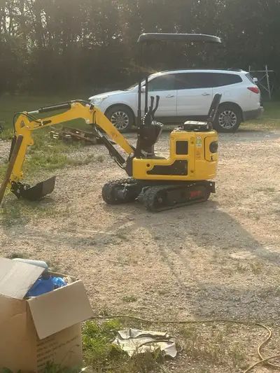1 ton mini excavator with jack hammer auger. Digging bucket and clean up bucket and 40 hp skidsteer...