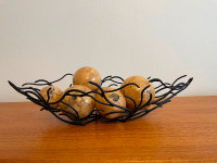 Metal wire basket and botanical pods.